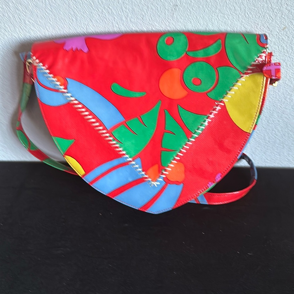 Multi color handbag with shoulder strap